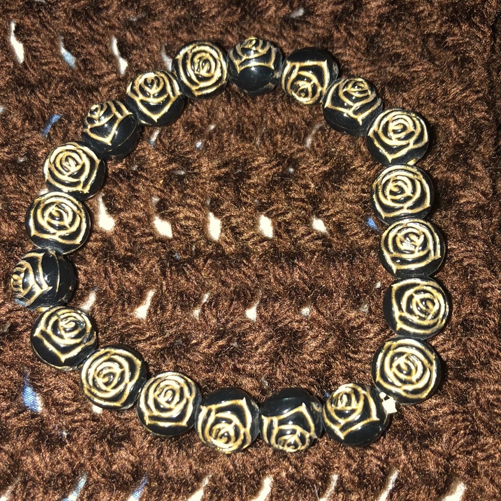 Adjustable rose scrolled bracelet